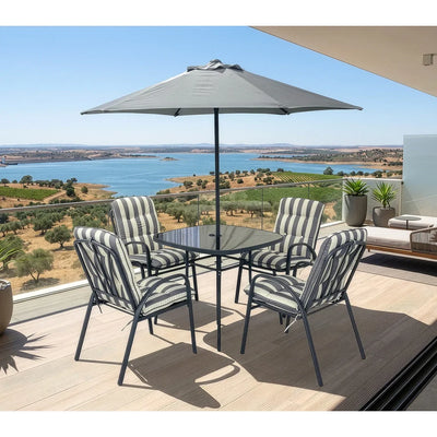 Conjunto de comedor de exterior Piave con mesa de vidrio, 4 sillas y sombrilla